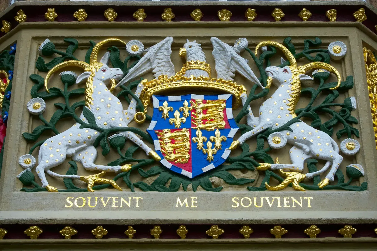 Close-up of the detailed bas relief crest at Christ's College, Cambridge, UK.